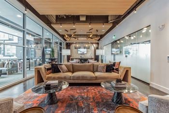 A living room with a couch and tables